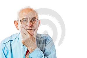 Portrait of 90 year serious handsome senior man holding his chin portrait isolated on white background