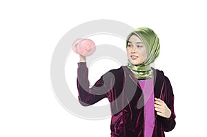 Portrait of a active healthy hijab woman and dumbells for promoting a healthy fitness and lifestyle concept