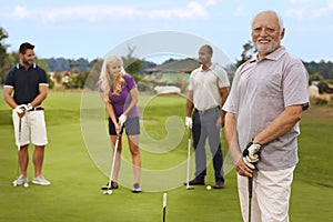 Portrait of active senior on the golf course