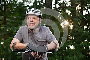 Portrait of active senior man with his bike in outside, healthy lifestyle sport concept