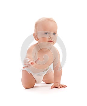 Portrait of adorable baby boy crawling over white