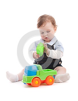 Portrait of adorable baby boy playing with toys