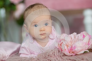 Portrait of adorable baby girl in pink dress