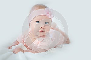 Portrait of adorable baby girl in pink dress