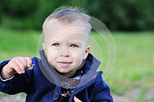 Portrait of adorable blond baby boy