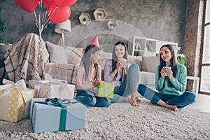 Portrait of adorable careful attractive cheerful family sharing giftboxes congrats drinking beverage new year xmas at