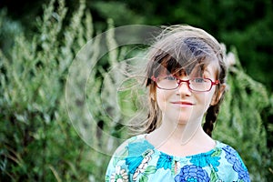 Portrait of adorable child girl in glasses