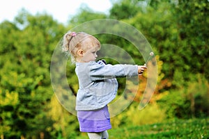 Portrait of adorable child girl walking outdoors