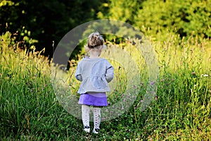 Portrait of adorable child girl walking outdoors