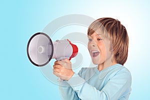 Portrait of adorable child with a megaphone