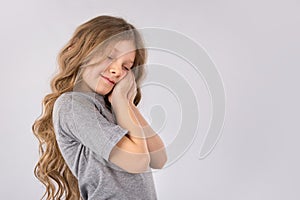 Portrait of adorable dreaming little girl isolated on a white