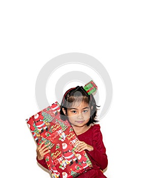 Portrait of adorable girl with giftbox looking at the camera