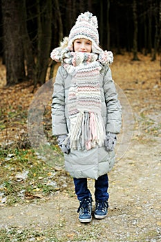 Portrait of adorable girl outdoor in winter park