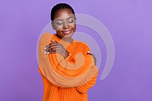 Portrait of adorable gorgeous girl closed eyes arms hug shoulder warmth soft isolated on violet color background