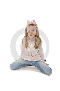 Portrait of a adorable little girl sitting on knee, posing