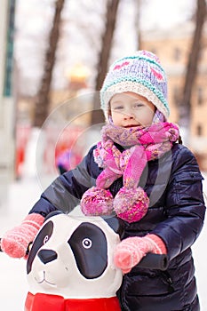 Portrait of adorable little girl on skating rink