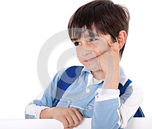 Portrait of a adorable school boy thinking