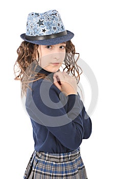 Portrait of adorable smiling girl child schoolgirl with curl hair in hat