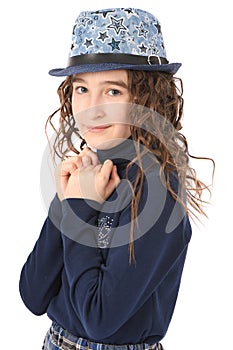 Portrait of adorable smiling girl child schoolgirl with curl hair in hat