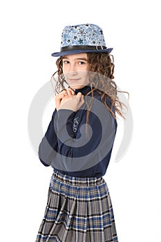 Portrait of adorable smiling girl child schoolgirl with curl hair in hat