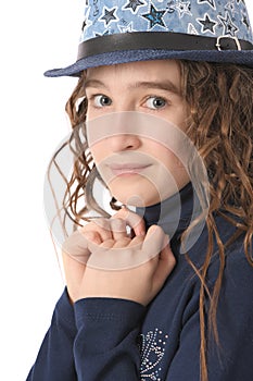 Portrait of adorable smiling girl child schoolgirl with curl hair in hat