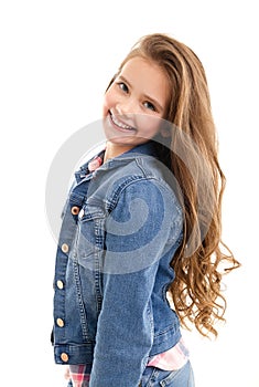 Portrait of adorable smiling little girl child preteen standing isolated