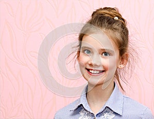 Portrait of adorable smiling little girl schoolgirl child 