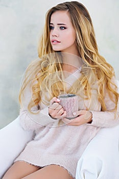 Portrait of adorable woman with cup of coffee