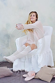 Portrait of adorable woman holding a cup of hot tea