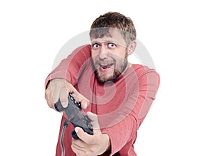 Portrait of adult bearded man holding joystick and playing videogames, isolated on white background