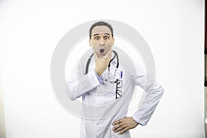 Portrait of adult caucasian doctor in white medical coat, scared in shock, panic
