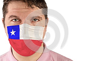 Portrait of adult caucasian man who wears protective mask on his face against influenza and protect health from bacteria. Flag of