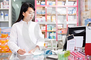 Portrait of adult chinese female pharmacist