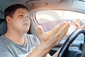 Portrait adult male caucasian men waving hands gesture pissed off by driver in front of car in traffic jam. Angry