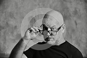 portrait adult man bald white beard face scared expression thoughtful male model gentleman in black clothes image