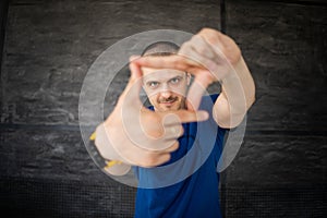 Portrait of adult man in blue t-shirt