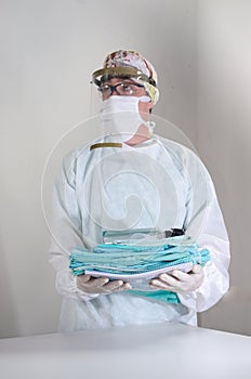 Portrait of adult man doctor or nurse wearing PPE uniform working in hospital