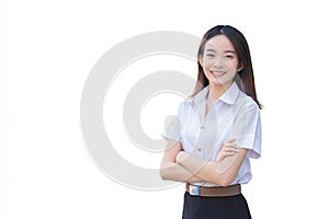 Portrait of adult Thai student in university student uniform. Asian girl smiling and confidently with her arms crossed on school