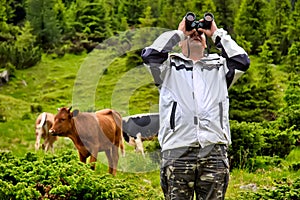 Portrait of adventure man with binoculars