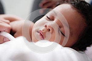 Portrait of african american baby boy sleeping
