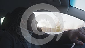 Portrait of african american black driver driving a car