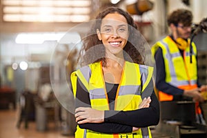 portrait african american black woman worker happy smile work in heavy metal machine industry