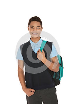 Portrait of African-American boy in school uniform with backpack on white