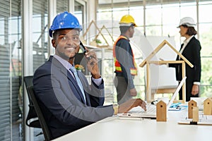 Portrait african american engineer confident business project manager using smartphone to communicate business in the meeting room