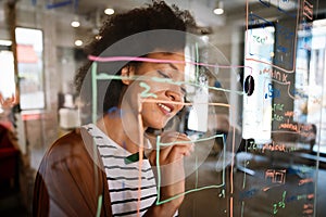 Portrait of african american female IT developer, programmer, designer working with programming code