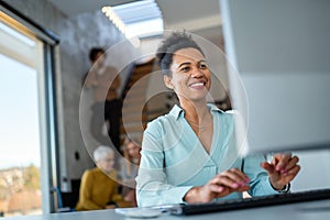 Portrait of african american female IT developer, programmer, designer working with programming code