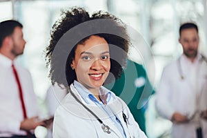 Portrait of african american female doctor on hospital looking at camera