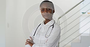 Portrait of african american female doctor looking to camera smiling