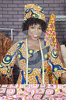 Portrait of an African American female fashion designer with pattern cloth