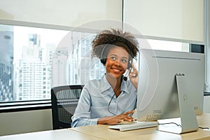 portrait the african american female wear headsets is working in a call centre